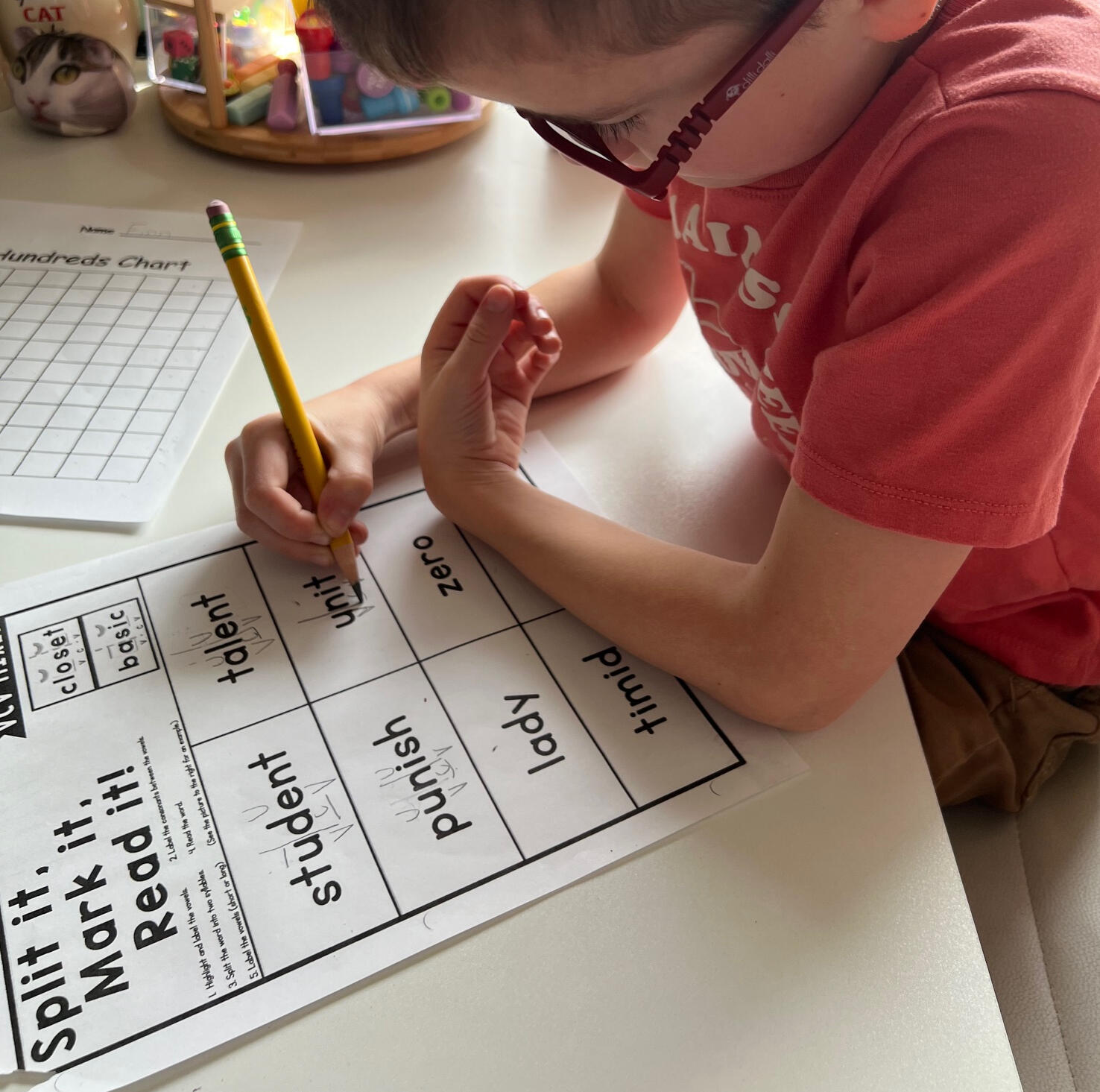 Maniplulatives, like place value blocks, are helpful when learning new math concepts. image of a light skinned child learning with Velcro letter mats are a great way to word chain and practice spelling words with our targeted phonics concept.